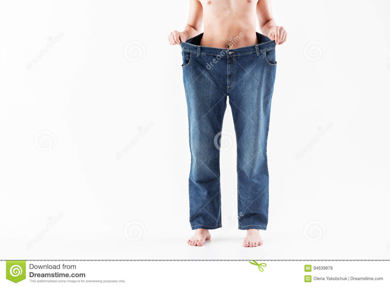 thin-guy-wearing-oversized-trousers-close-up-legs-young-slim-man-holding-large-jeans-successfu...jpg